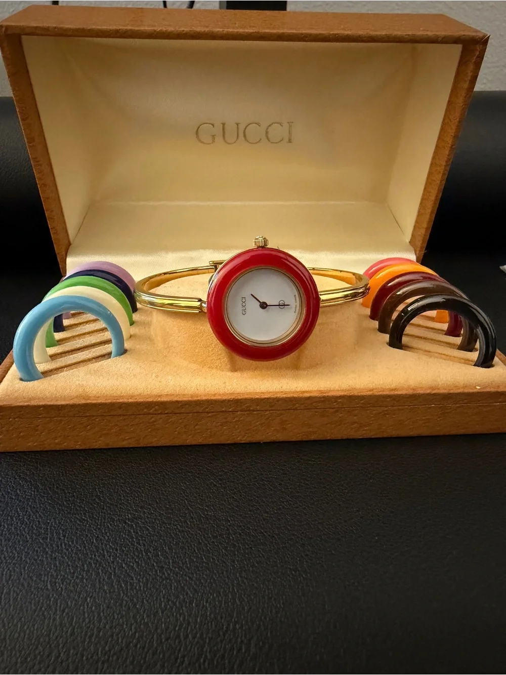 Gucci Gold Bangle Watch with Red Bezel and Interchangeable Color Bezels